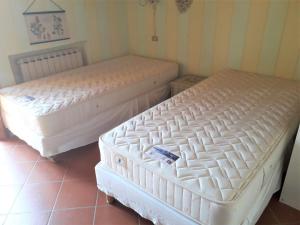 A bed or beds in a room at Casa Conny