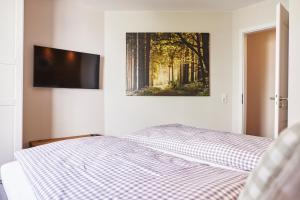 Postel nebo postele na pokoji v ubytování Mountain Suites Braunlage - Bergzauber
