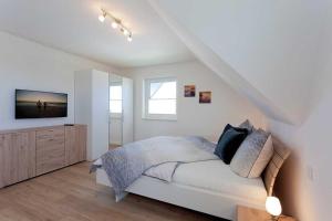 Postel nebo postele na pokoji v ubytování Ferienhaus Alt Sallenthin 10, "Meer" + 31 fotografií