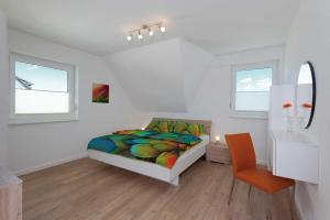 Postel nebo postele na pokoji v ubytování Ferienhaus Alt Sallenthin 10, "Meer"