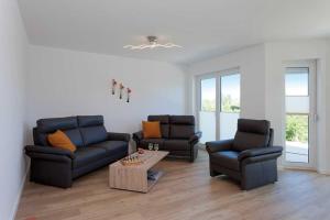 Posezení v ubytování Ferienhaus Alt Sallenthin 10, "Meer"