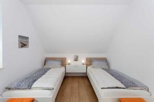 Postel nebo postele na pokoji v ubytování Ferienhaus Alt Sallenthin 10, "Meer"