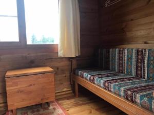 a log cabin with a bench and a window at Kardelen Bungalov Evleri̇ in Ayder Yaylasi +26 photos