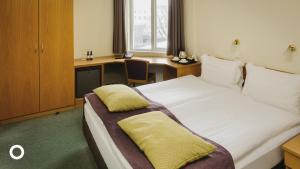 En eller flere senger på et rom på Center Hotels Skjaldbreid