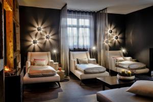 a living room with two chairs and a couch at Hotel Ritter Durbach in Durbach