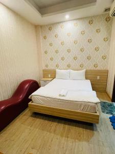 Postel nebo postele na pokoji v ubytování Hotel Quỳnh Anh