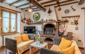 a living room with two couches and a fireplace at Casa Andrea in Culla