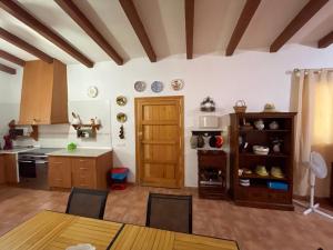 a kitchen with a table and a counter top at Cortijo CANO in Cuevas del Almanzora