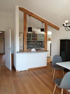 a kitchen and dining room with a table and chairs at Gästehaus Ahlers in Goldenstedt in Goldenstedt