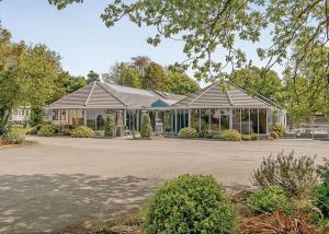 a building with a pavilion in a park at Croft Country Park in Reynalton