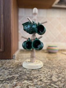 a small toy microphone on a kitchen counter at Cabana Vălul Miresei Apuseni in Răchiţele +46 photos