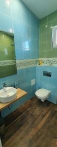 a bathroom with a sink and a toilet at Къща за гости Свети Йоан Кръстител in Varna City