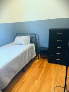 a bedroom with a bed and a dresser at 3BD/2BA in Historic Hyde Park Neighborhood w/ Parking Near University of Chicago in Chicago