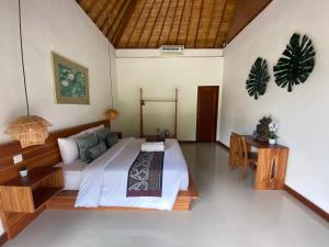 Ein Bett oder Betten in einem Zimmer der Unterkunft Umah Nik Kepitu