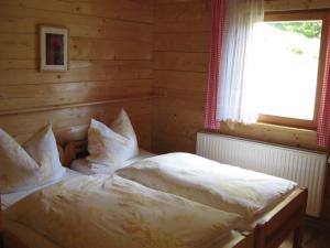 Postel nebo postele na pokoji v ubytování Almhütte Tschiernock