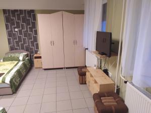 Postel nebo postele na pokoji v ubytování Pingpong Apartman