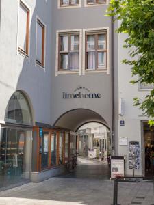 a building with an entrance to a store at limehome Augsburg Annastraße in Augsburg