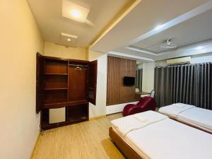 Postel nebo postele na pokoji v ubytování Hotel Quỳnh Anh