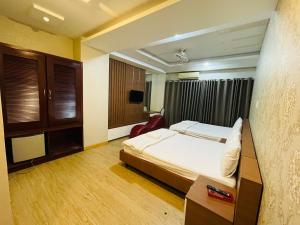 Postel nebo postele na pokoji v ubytování Hotel Quỳnh Anh