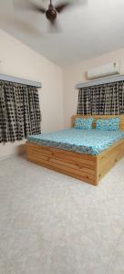 Säng eller sängar i ett rum på Sudeep Bungalow