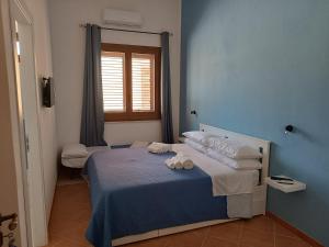 Postel nebo postele na pokoji v ubytování Ilary's Rooms