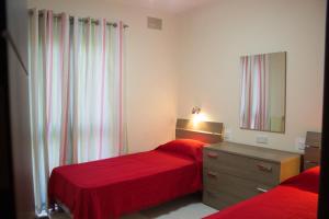 En eller flere senger på et rom på Apartment Triq is-Silla