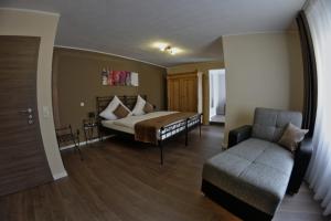 Кровать или кровати в номере Apado-Hotel garni