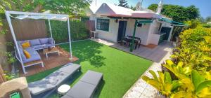 A garden outside Bungalows Playa Flor, Campo Internacional, Maspalomas.