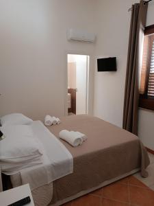 Postel nebo postele na pokoji v ubytování Ilary's Rooms