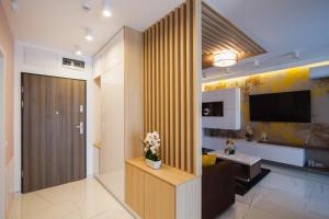 a living room with a sliding door and a television at Romantic getaway at West Residence in Oradea +25 photos