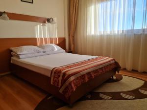 Postel nebo postele na pokoji v ubytování Hotel Transit