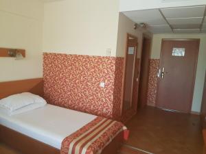 Postel nebo postele na pokoji v ubytování Hotel Transit