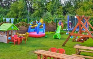 a playground with children playing in a park at Stunning Home In Sianozety With Kitchenette in Sianozety