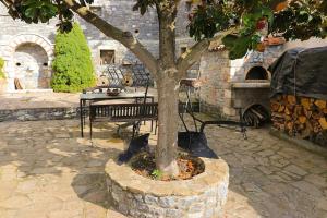 A patio or other outdoor area at Magnolia Traditional Stone House in Vamvakou