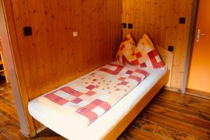 A bed or beds in a room at Sporthotel Oberwald