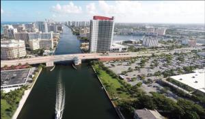 an aerial view of a city with a bridge over a river at Apartment 1B-1B Amazing View BW 30A in Hallandale Beach