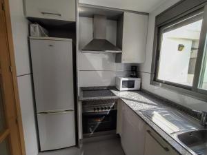 Dapur atau dapur kecil di Atico Oliva Nova - MET