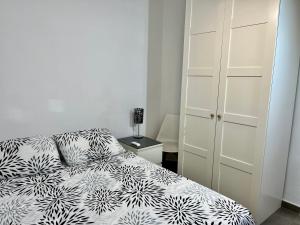 Posteľ alebo postele v izbe v ubytovaní Apartamento CANDELA