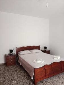 Postel nebo postele na pokoji v ubytování Kostas Maria Apartment 109m2 1st Floor