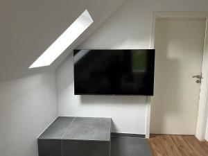 TV a/nebo společenská místnost v ubytování Deich Winde 9.1 + 2 fotografie