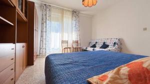 A bed or beds in a room at Zago