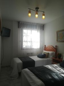 Fotografia z galérie ubytovania Apartamento en edificio nuevo con piscina, con vistas a la ría y al puerto, perfil familiar, no se admiten grupos de jóvenes v destinácii Sanxenxo
