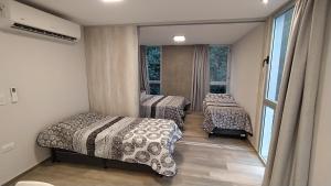 Ένα ή περισσότερα κρεβάτια σε δωμάτιο στο Apart Hotel La Campiña