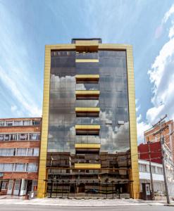 a tall building with a lot of windows at Hotel City Bog Corferias in Bogotá