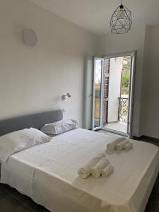 Postel nebo postele na pokoji v ubytování Pellegrino Rooms