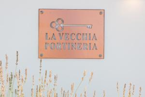 a sign that reads la vecteria portentinas at La Vecchia Portineria in Cetara