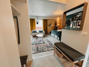 a view of a living room with a couch and a table at Pieni lomahuoneisto ja ulkoporeallas in Mynämäki