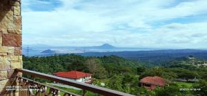 a view of the mountains from a balcony of a house at Splendido Tagaytay Taal Lake Staycation Free Parking No Free Pool No Pet in Tagaytay