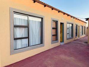 a row of windows on the side of a building at Druza’s guest house in Rustenburg