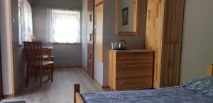 Postel nebo postele na pokoji v ubytování Gosciniec Pod Brzegiem
